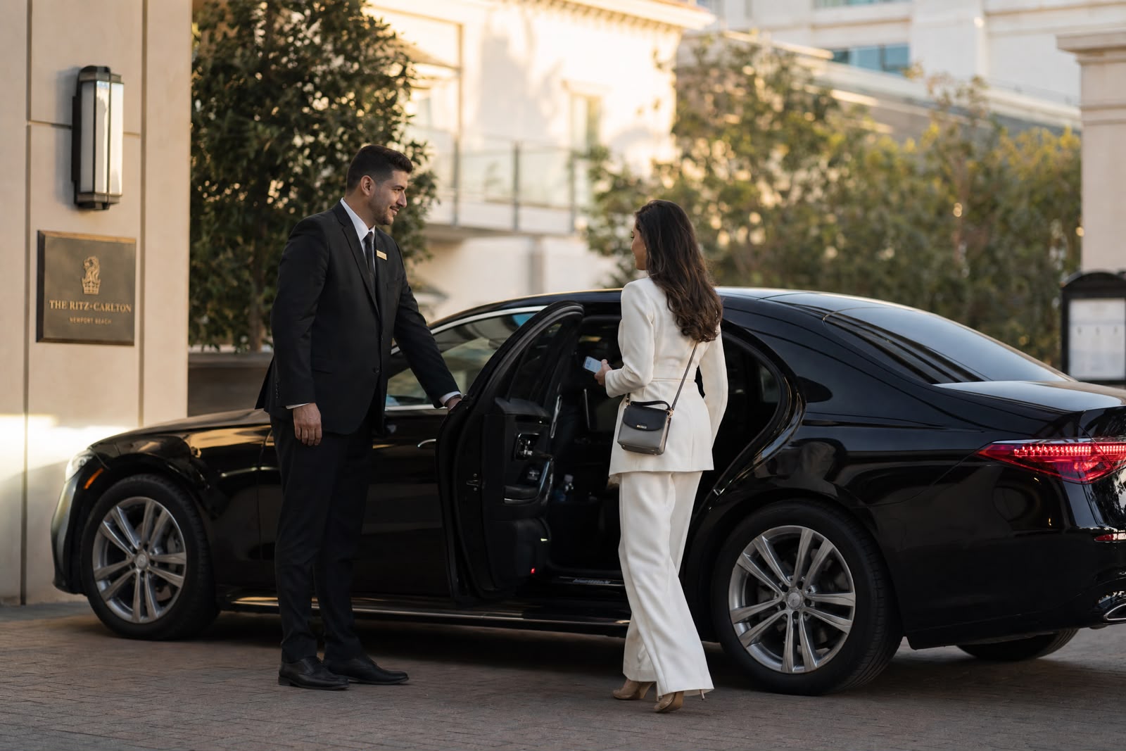 Black executive sedan prepared for a priority reservation